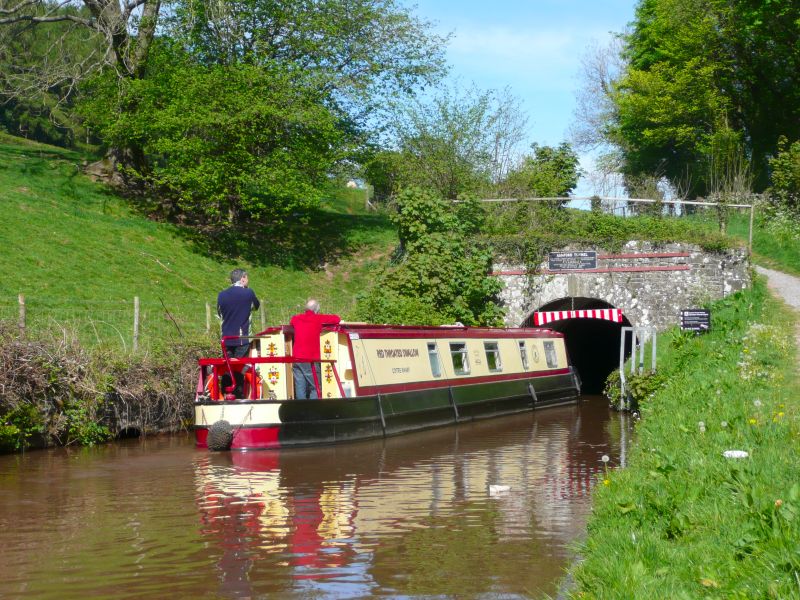 Canal boat entering the Ashford Tunnel